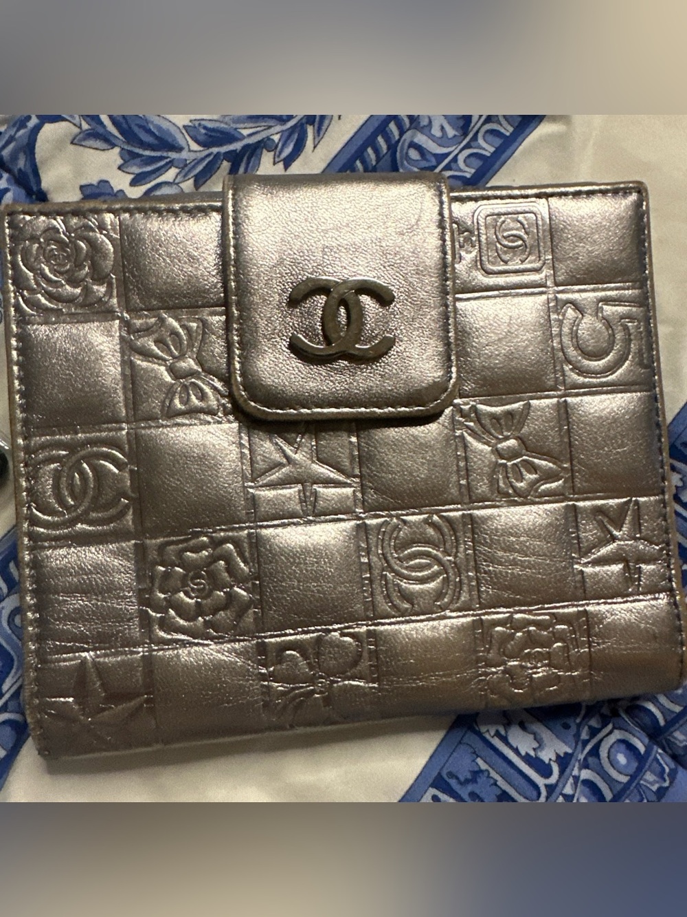 Authentic CHANEL Metallic Silver Embossed CC Symbols Bifold Leather Wallet COA